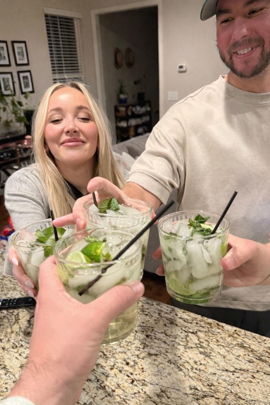 Friends cheersing mojito cocktails