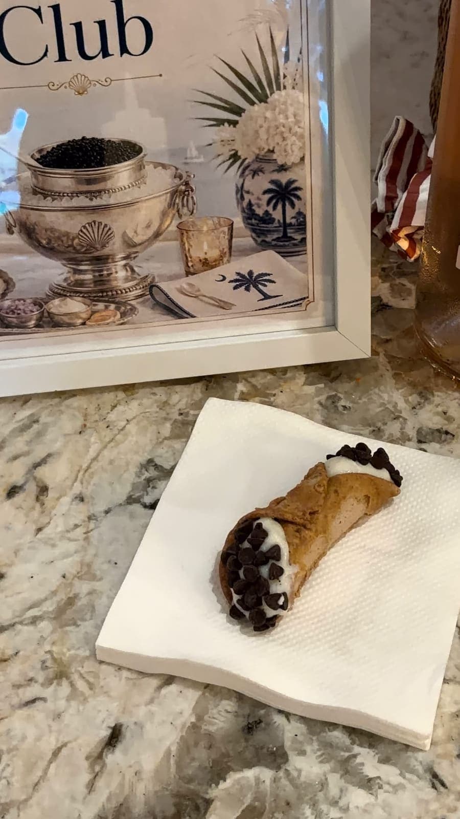 Chocolate chip cannoli served beside Casey's Caviar Club display
