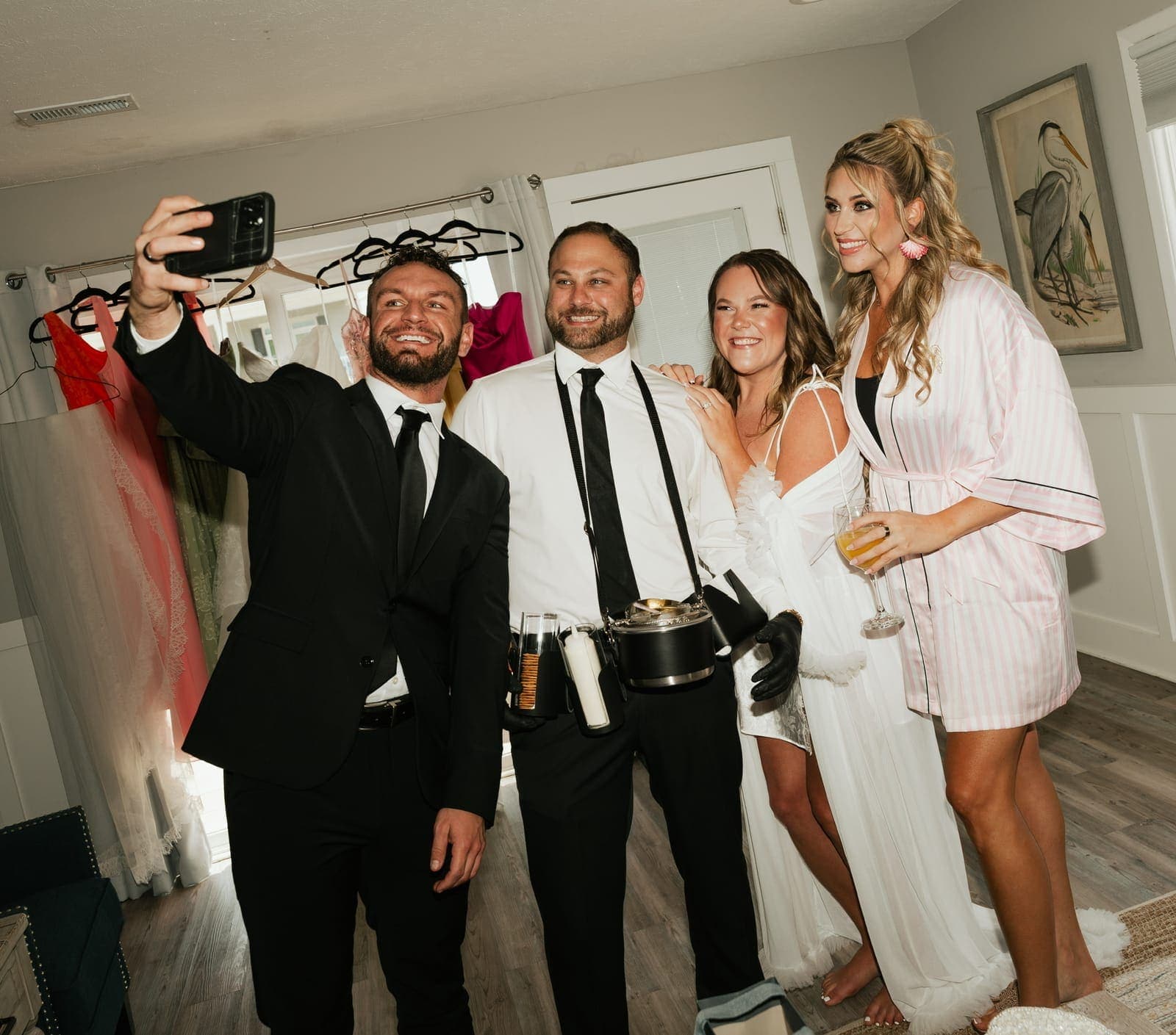 Bride and bridal party posing with the caviar server